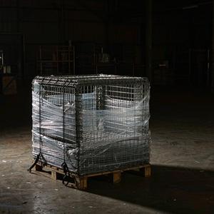Folded wire containers strapped on an export pallet