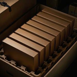 Flat-packed rigid boxes in an export carton