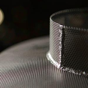 Close-up of a welded seam on a mesh filter cylinder