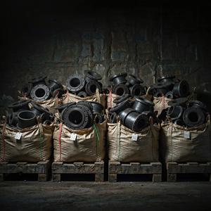 Pipe fittings in woven bags on export pallets