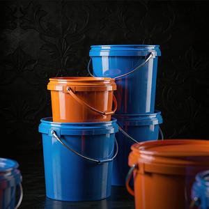 Tower of vivid blue and orange food-grade plastic pails