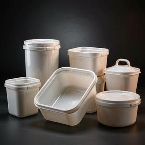 Pearl-white glossy plastic containers in studio light