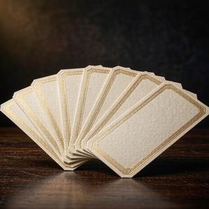Premium cream wine labels with gold foil borders fanned out