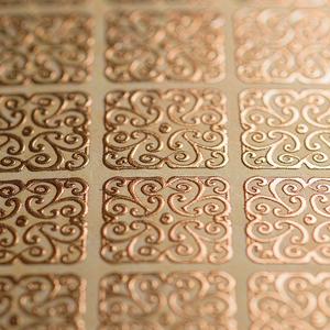 Macro of gold foil embossed label texture